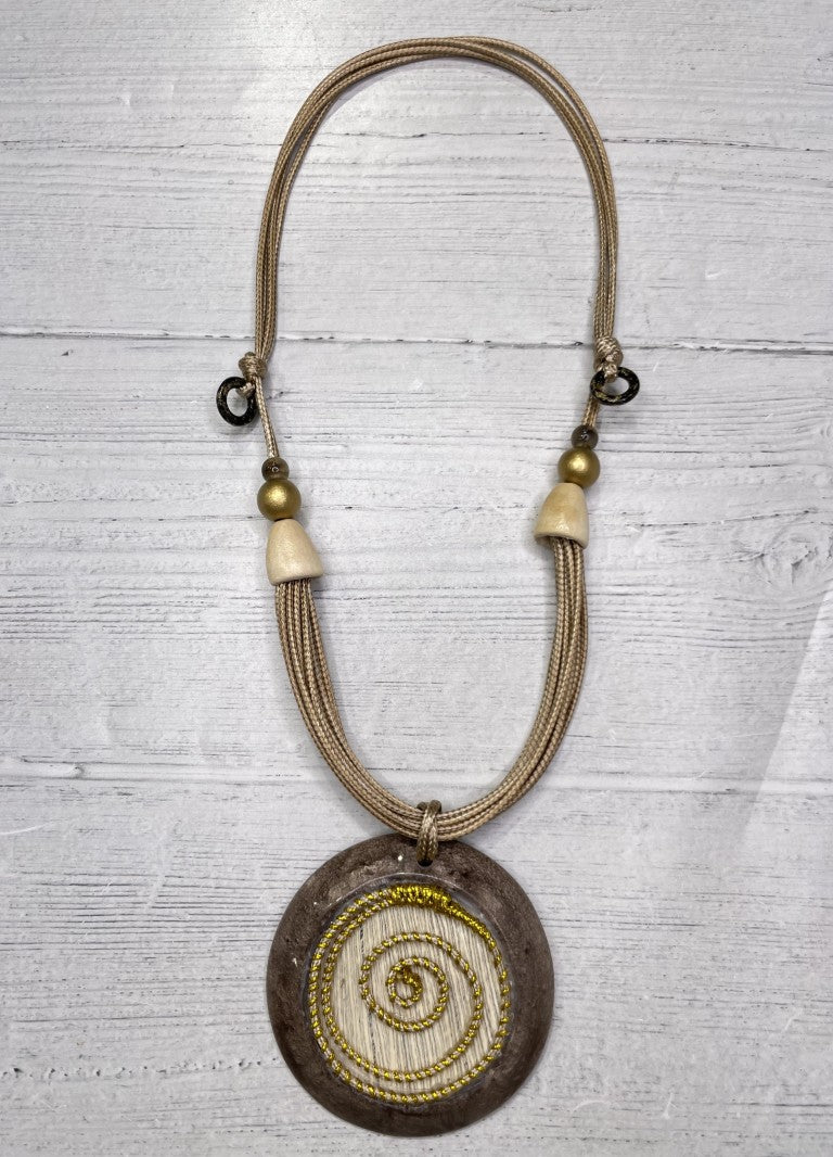 Alisha D Beige Resin Pendant Necklace With Golden Spiral