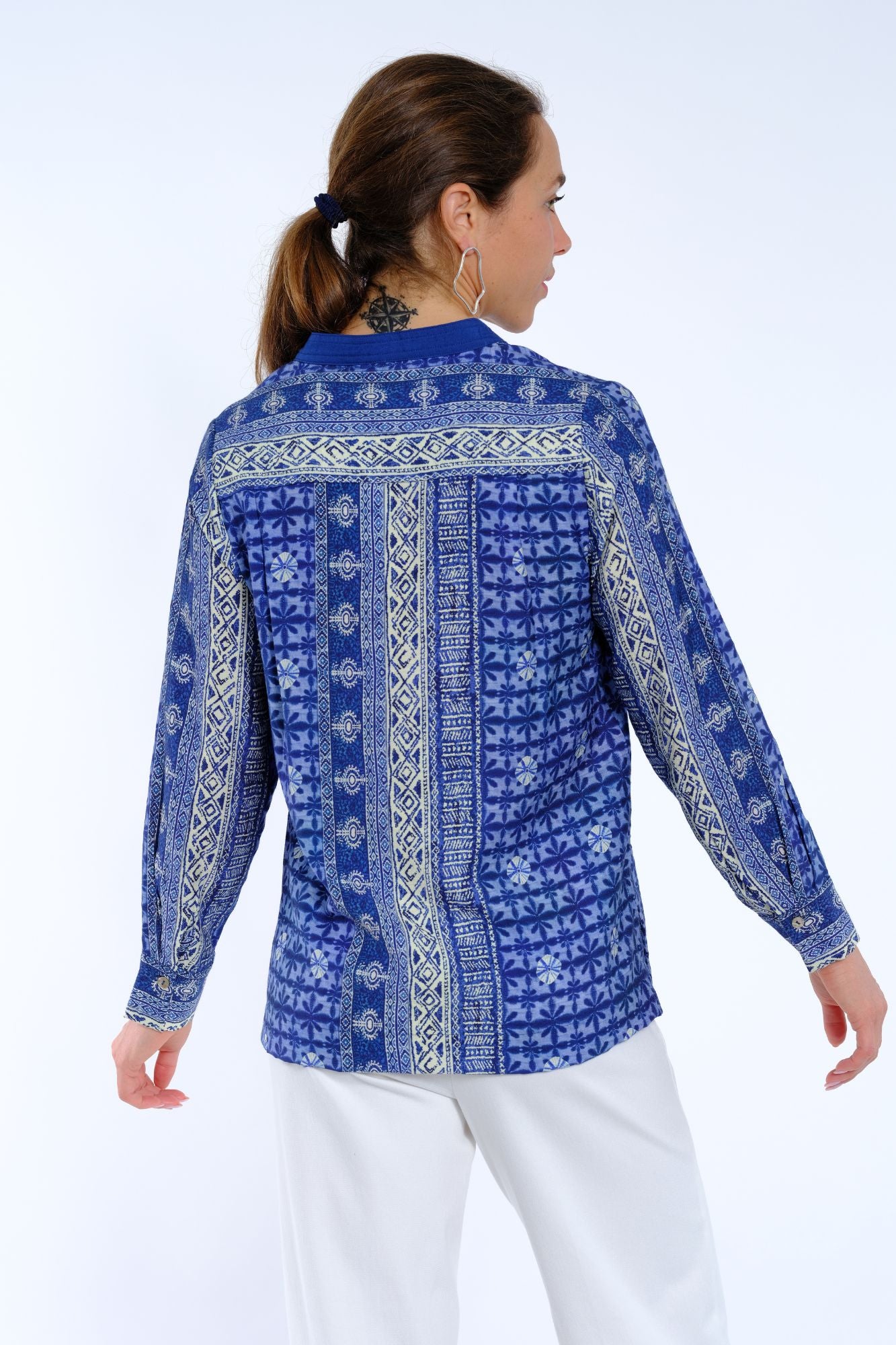 Women’s long sleeve printed tunic blouse by LIOR with split neckline and relaxed fit